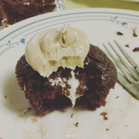 Chocolate cupcake with cream cheese filling and peanut butter icing